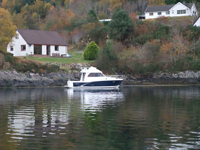 Our boat in front of Seaside Cottage