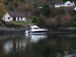 Our boat in front of Seaside Cottage